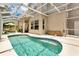 Backyard swimming pool with screened enclosure and patio, perfect for outdoor relaxation at 17300 Summer Sun Ct, Clermont, FL 34711