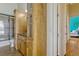 Well-maintained bathroom featuring a glass-door shower and wood cabinetry for storage at 18008 Victorian Dr, Clermont, FL 34715
