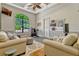 The flex room includes a wall-mounted TV, an exercise bike, and cozy seating at 18008 Victorian Dr, Clermont, FL 34715