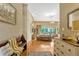 Inviting home foyer with hardwood floors, decorative accents, and a view of the living room at 18008 Victorian Dr, Clermont, FL 34715