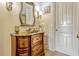 A close-up of the half bathroom features a decorative vanity with a vessel sink at 18008 Victorian Dr, Clermont, FL 34715