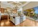 Gourmet kitchen with a large island, granite countertops, and stainless steel appliances at 18008 Victorian Dr, Clermont, FL 34715