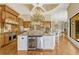 Spacious kitchen features stainless steel appliances, granite countertops, and an island with wine storage at 18008 Victorian Dr, Clermont, FL 34715
