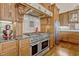 Gourmet kitchen features stainless steel appliances, custom cabinetry, and an elegant tile backsplash at 18008 Victorian Dr, Clermont, FL 34715