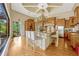 Gourmet kitchen with an oversized island, granite countertops, stainless steel appliances, and a breakfast bar at 18008 Victorian Dr, Clermont, FL 34715