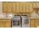 Well-organized laundry room with modern stainless steel washer and dryer, and ample cabinet storage at 18008 Victorian Dr, Clermont, FL 34715