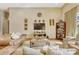 Comfortable living room boasting neutral tones, modern decor, and a cozy seating area under high ceilings at 18008 Victorian Dr, Clermont, FL 34715