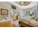 Serene main bedroom features tray ceiling, sitting area, and arched doorways at 18008 Victorian Dr, Clermont, FL 34715