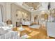 Expansive main bedroom featuring a tray ceiling, sitting area, and spa-like ensuite bathroom access at 18008 Victorian Dr, Clermont, FL 34715