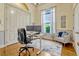 Bright office space with hardwood floors, large window, and comfortable workspace for an at-home professional at 18008 Victorian Dr, Clermont, FL 34715