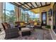 Covered patio with comfortable seating, a ceiling fan, and outdoor television at 18008 Victorian Dr, Clermont, FL 34715