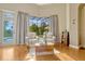 Cozy sitting area offers an abundance of natural light and serene pool views at 18008 Victorian Dr, Clermont, FL 34715