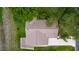 Direct aerial view shows the roof of a home, with surrounding mature landscaping and lawn at 1815 Kaufman Cir, Lady Lake, FL 32159