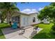 Exterior patio with seating offering an inviting spot to enjoy the backyard at 1815 Kaufman Cir, Lady Lake, FL 32159