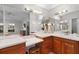 Bathroom vanity with lots of mirror space and a view into the main bedroom at 1815 Kaufman Cir, Lady Lake, FL 32159