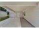 Spacious carport offering covered parking and convenient access to garage and house at 1815 Kaufman Cir, Lady Lake, FL 32159