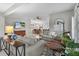 Open living room with neutral walls, cozy furniture, and view into the dining area at 1815 Kaufman Cir, Lady Lake, FL 32159