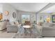 Inviting living room with neutral tones, comfortable seating, and large windows that brighten the room at 1815 Kaufman Cir, Lady Lake, FL 32159