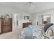 Spacious main bedroom with dresser and access to a bathroom and closet at 1815 Kaufman Cir, Lady Lake, FL 32159