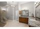 Open plan bathroom with double vanity, walk-in shower and granite countertops at 1920 Iglesia St, The Villages, FL 32159