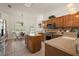 Spacious kitchen with stainless steel appliances, granite countertops, breakfast nook and center island at 1920 Iglesia St, The Villages, FL 32159