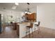 Kitchen with breakfast bar, granite countertops, stainless appliances and eat-in breakfast nook at 1920 Iglesia St, The Villages, FL 32159