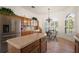 Eat-in kitchen featuring granite countertops and breakfast nook with natural light at 1920 Iglesia St, The Villages, FL 32159