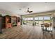 Open concept living room with beautiful wood floors, elegant furnishings, and water views at 1920 Iglesia St, The Villages, FL 32159