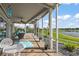Inviting screened patio with beautiful lake view, comfortable furniture, and a relaxing atmosphere at 1920 Iglesia St, The Villages, FL 32159