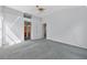 Bedroom features neutral color walls, ceiling fan, carpet and an en-suite bathroom at 206 Palermo Pl, Lady Lake, FL 32159