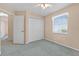 Bedroom features a large closet, window and entrance to another room at 206 Palermo Pl, Lady Lake, FL 32159