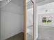 View of a bedroom features neutral walls, ceiling fan and a sliding closet door with mirror at 206 Palermo Pl, Lady Lake, FL 32159