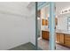 View of a closet looking into a bathroom with a double sink and shower at 206 Palermo Pl, Lady Lake, FL 32159