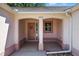 Inviting front porch featuring a charming front door and classic architectural details at 206 Palermo Pl, Lady Lake, FL 32159
