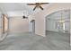 Living room with high ceilings, ceiling fans, and arched doorways to the home's other rooms at 206 Palermo Pl, Lady Lake, FL 32159