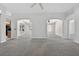 Bright living room with arched doorways leading to the kitchen and other rooms at 206 Palermo Pl, Lady Lake, FL 32159