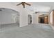 Open-concept living room with arched doorways leading to the kitchen and other rooms at 206 Palermo Pl, Lady Lake, FL 32159
