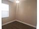 Neutral bedroom featuring wood-look floors, a window, and a ceiling fan at 222 Bacopa Pass, Davenport, FL 33897
