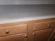 Close-up of the kitchen countertop showcasing the well-maintained cabinets at 222 Bacopa Pass, Davenport, FL 33897