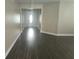 Bright living room featuring wood floors and a modern open concept design at 222 Bacopa Pass, Davenport, FL 33897