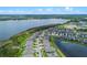 A scenic aerial view of lakeside homes with lush landscaping and waterfront access at 2330 Nuthatch St, St Cloud, FL 34771