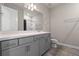 Neutral bathroom featuring a long vanity, recessed lighting, framed mirror and private toilet at 2330 Nuthatch St, St Cloud, FL 34771