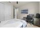 Comfortable bedroom featuring a ceiling fan, television, computer desk and a large closet at 2330 Nuthatch St, St Cloud, FL 34771