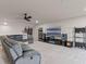 Comfortable living area with a large sectional sofa, media, and entertainment center at 2330 Nuthatch St, St Cloud, FL 34771