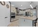 Well-equipped kitchen featuring granite countertops, stainless steel appliances, and a functional center island at 2330 Nuthatch St, St Cloud, FL 34771