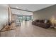 Spacious living room features wood-look tile flooring and view to back patio at 2330 Nuthatch St, St Cloud, FL 34771