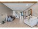 Open concept living room with beautiful flooring and a view of the staircase at 2330 Nuthatch St, St Cloud, FL 34771