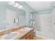 Bathroom featuring a shower-tub combo and dual sinks at 2336 Martins Run, Tavares, FL 32778
