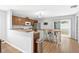 Bright kitchen with wooden cabinets, stainless steel appliances and breakfast bar at 2336 Martins Run, Tavares, FL 32778