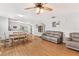 Spacious living area with wood floors, dining area and comfortable sofas at 2336 Martins Run, Tavares, FL 32778